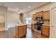 Stylish kitchen featuring a center island, stainless steel oven, and granite countertops at 2506 Creek Station Dr, Buford, GA 30519