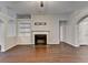 Inviting living room features hardwood floors, a fireplace, and built-in shelving, creating a cozy and organized space at 2506 Creek Station Dr, Buford, GA 30519