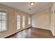 Living room featuring hardwood floors and french doors for natural light at 2506 Creek Station Dr, Buford, GA 30519