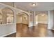 Open living room with archways to other rooms at 2506 Creek Station Dr, Buford, GA 30519