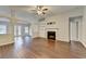 Bright living room with hardwood floors, built-in shelves, and a charming fireplace, creating a welcoming atmosphere at 2506 Creek Station Dr, Buford, GA 30519