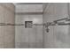 Shower stall with ceramic tiling and accent mosaic tiles at 2506 Creek Station Dr, Buford, GA 30519
