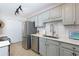 Updated kitchen with modern appliances, light gray cabinetry, and a stylish backsplash for a contemporary cooking space at 407 Brighton Pt, Atlanta, GA 30328