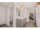 Bathroom featuring double vanity, ample counter space, and views into the Primary bedroom at 8588 Secretariat Dr, Lithonia, GA 30058