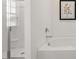 Bright bathroom featuring a soaking tub and separate glass enclosed shower at 8588 Secretariat Dr, Lithonia, GA 30058