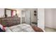 Comfortable bedroom featuring a gray accent bench, closet and decor perfect for a sports enthusiast at 8588 Secretariat Dr, Lithonia, GA 30058