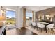 Bright dining area with wood floors, neutral walls, and contemporary decor creating an elegant space at 8588 Secretariat Dr, Lithonia, GA 30058