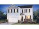 Charming two-story home features stone accents, a two-car garage, and a well-manicured lawn at 8588 Secretariat Dr, Lithonia, GA 30058