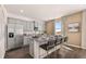 Spacious kitchen features stainless steel appliances, a large island, and modern finishes at 8588 Secretariat Dr, Lithonia, GA 30058