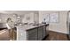Modern kitchen island with granite countertops and stainless steel appliances at 8588 Secretariat Dr, Lithonia, GA 30058