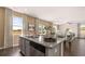 Kitchen island featuring a granite countertop, stainless steel appliances, and an undermount sink at 8588 Secretariat Dr, Lithonia, GA 30058