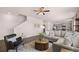 Open-concept living area connects living room, kitchen, and staircase; features modern decor at 8588 Secretariat Dr, Lithonia, GA 30058