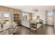 Cozy living room and dining room with hardwood floors and plenty of sunlight at 8588 Secretariat Dr, Lithonia, GA 30058