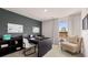Modern home office with sleek desk, shelving, chair and window overlooking a serene field at 8588 Secretariat Dr, Lithonia, GA 30058
