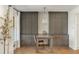 Living area featuring gray cabinets with brass hardware, light fixture, and hardwood floors at 1335 Chaucer Ne Ln, Brookhaven, GA 30319