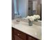 Bright bathroom vanity with double sinks, storage cabinets and white quartz countertop at 179 Silver Arrow Cir, Austell, GA 30168