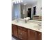 Bright bathroom vanity with double sinks, storage cabinets and large mirror at 179 Silver Arrow Cir, Austell, GA 30168