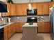Kitchen with wooden cabinets and stainless-steel appliances at 179 Silver Arrow Cir, Austell, GA 30168
