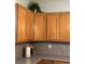 Upper kitchen cabinets with lighting and gray backsplash at 179 Silver Arrow Cir, Austell, GA 30168