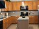 Kitchen with wooden cabinets and stainless-steel appliances at 179 Silver Arrow Cir, Austell, GA 30168