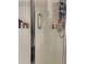 Shower with a safety handle, lots of storage and sliding glass door at 179 Silver Arrow Cir, Austell, GA 30168