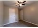 Bedroom with ceiling fan and neutral color scheme is ready for your personal touch at 1940 Matthew Way, Lithonia, GA 30058