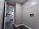 Laundry room featuring hookups, a wire shelf, and access to a modern kitchen at 1940 Matthew Way, Lithonia, GA 30058