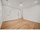 Bright bedroom featuring hardwood floors, a ceiling fan, and spacious closet at 2433 Helmsdale Ne Dr, Atlanta, GA 30345