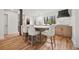 Modern kitchen island with barstool seating, marble countertops and wood cabinets at 2433 Helmsdale Ne Dr, Atlanta, GA 30345