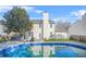 Enjoy this backyard's inviting in-ground pool, surrounded by beautiful stone and lush greenery at 5300 Willow Park Blvd, Atlanta, GA 30349