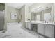 Bathroom with tiled floors, shower, tub, white cabinets, and double vanity sinks at 5300 Willow Park Blvd, Atlanta, GA 30349