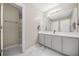 Bathroom with a large mirror, double vanity sinks, and a large walk-in shower at 5300 Willow Park Blvd, Atlanta, GA 30349