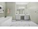 Bathroom with tiled floors, shower, tub, white cabinets, and double vanity sink at 5300 Willow Park Blvd, Atlanta, GA 30349