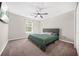 Bedroom featuring carpet flooring, a ceiling fan, and a view to the outside at 5300 Willow Park Blvd, Atlanta, GA 30349