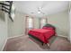 Bedroom with carpet flooring, a ceiling fan and view of a window at 5300 Willow Park Blvd, Atlanta, GA 30349