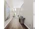 Inviting home hallway featuring wood flooring, neutral paint, natural lighting and decor at 5300 Willow Park Blvd, Atlanta, GA 30349