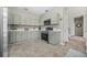 Kitchen featuring modern appliances, stone countertops, neutral paint and tile flooring at 5300 Willow Park Blvd, Atlanta, GA 30349