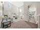 Bright living room featuring a fireplace, large windows, neutral walls, and plush carpet at 5300 Willow Park Blvd, Atlanta, GA 30349