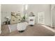 Bright living room featuring a fireplace, neutral walls, plush carpet, natural lighting and modern furniture at 5300 Willow Park Blvd, Atlanta, GA 30349