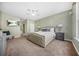 A bright main bedroom featuring a king bed, ceiling fan and neutral decor at 5300 Willow Park Blvd, Atlanta, GA 30349
