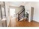 Inviting foyer with hardwood floors, staircase, and neutral paint, creating a warm and welcoming atmosphere at 1030 Laurel Valley Sw Dr, Marietta, GA 30064