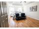 Spacious main bedroom featuring a tray ceiling, hardwood floors, and stylish decor at 1030 Laurel Valley Sw Dr, Marietta, GA 30064