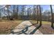 Long driveway leading up to a spacious three-car garage at 1511 Broadnax Mill Road, Loganville, GA 30052