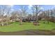 Stunning home reflected in the pond, set amidst a lush green lawn and mature trees at 1511 Broadnax Mill Road, Loganville, GA 30052