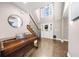 Bright foyer with a piano, hardwood floors, staircase, and a window above the front door at 1511 Broadnax Mill Road, Loganville, GA 30052