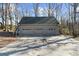 Three-car detached garage with a concrete driveway is a useful property feature at 1511 Broadnax Mill Road, Loganville, GA 30052