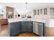 Kitchen island featuring stainless steel dishwasher, cabinets, and marble countertop at 1511 Broadnax Mill Road, Loganville, GA 30052