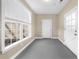 Mudroom with natural light, neutral colors, and easy access to the exterior from two doors at 1511 Broadnax Mill Road, Loganville, GA 30052