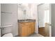 Bathroom featuring granite countertop, wood vanity, tile flooring, and a toilet at 250 Pharr Road Northeast Ne Rd, Atlanta, GA 30305