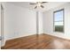 Bedroom with ceiling fan, window with bright view, and wood-look flooring at 250 Pharr Road Northeast Ne Rd # 1813, Atlanta, GA 30305